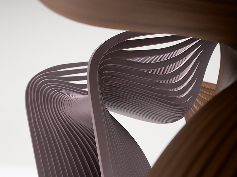 Complex parametric ceiling structure with purple artistic lighting